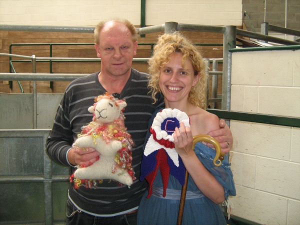 Rachel Matthews presenting the woolfest auction winner with his sheep