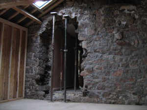 Hole from the house, showing corner stones from the bedroom